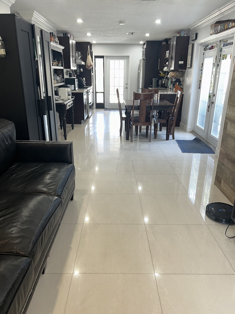 photo of open areas of kitchen dining and living rooms